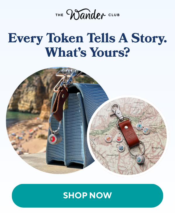 A blue handbag with a keychain and travel tokens on a beach, alongside a close-up of tokens on a vintage map.