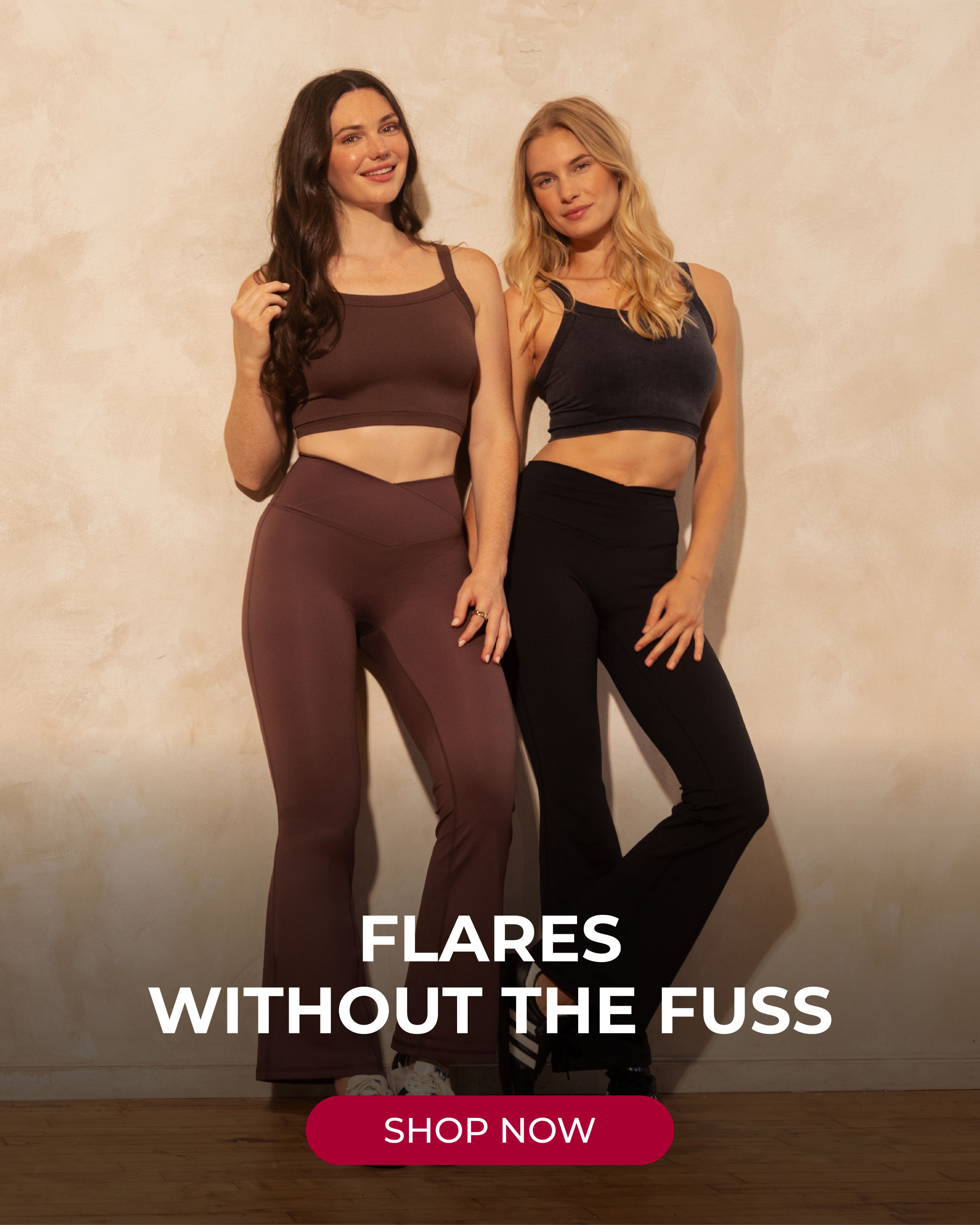Two women in a studio setting, one in a brown athleisure set and the other in a black athleisure set, both featuring flared leggings.